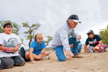 Tracking expert Dave Martine explains his techniques to a group of local youth during a Native Tracking Methods demonstration at Oso Vista Ranch near Pine Hill Tuesday. © 2011 Gallup Independent / Cable Hoover 